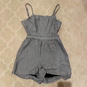 Black and white PacSun romper with tie back.